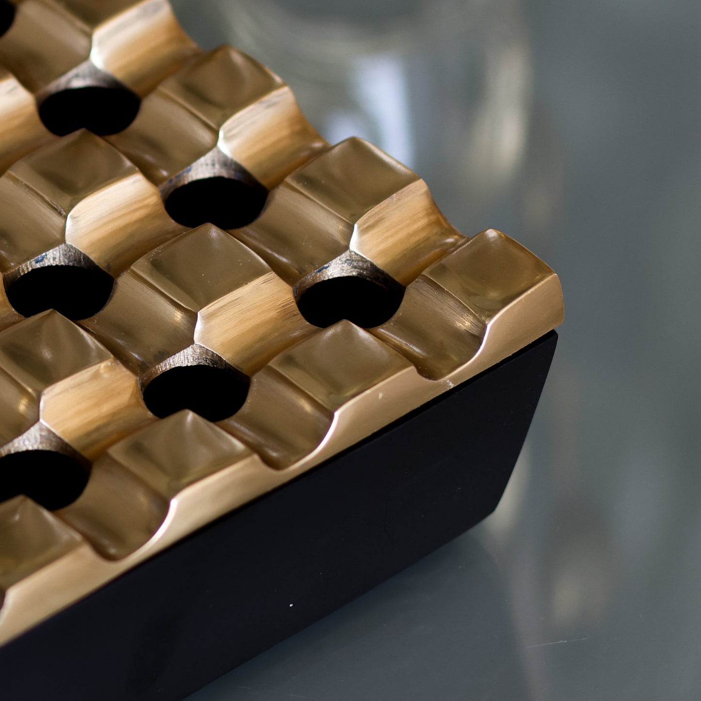 Antique brass and black ashtray