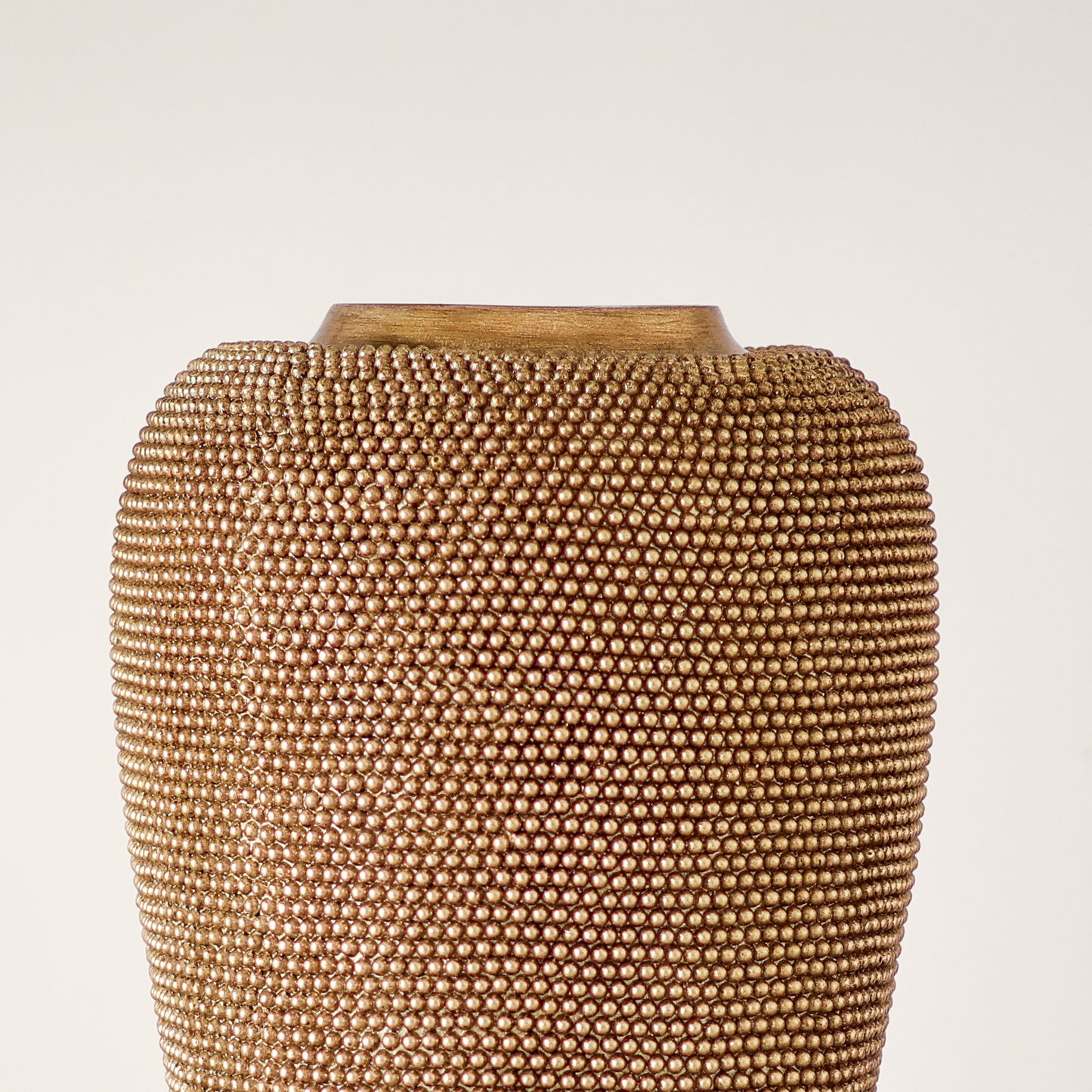 Gold beaded vase